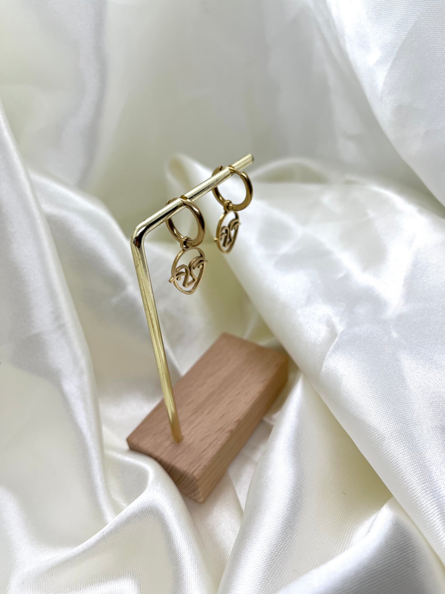 Boucles d’oreilles doré visage