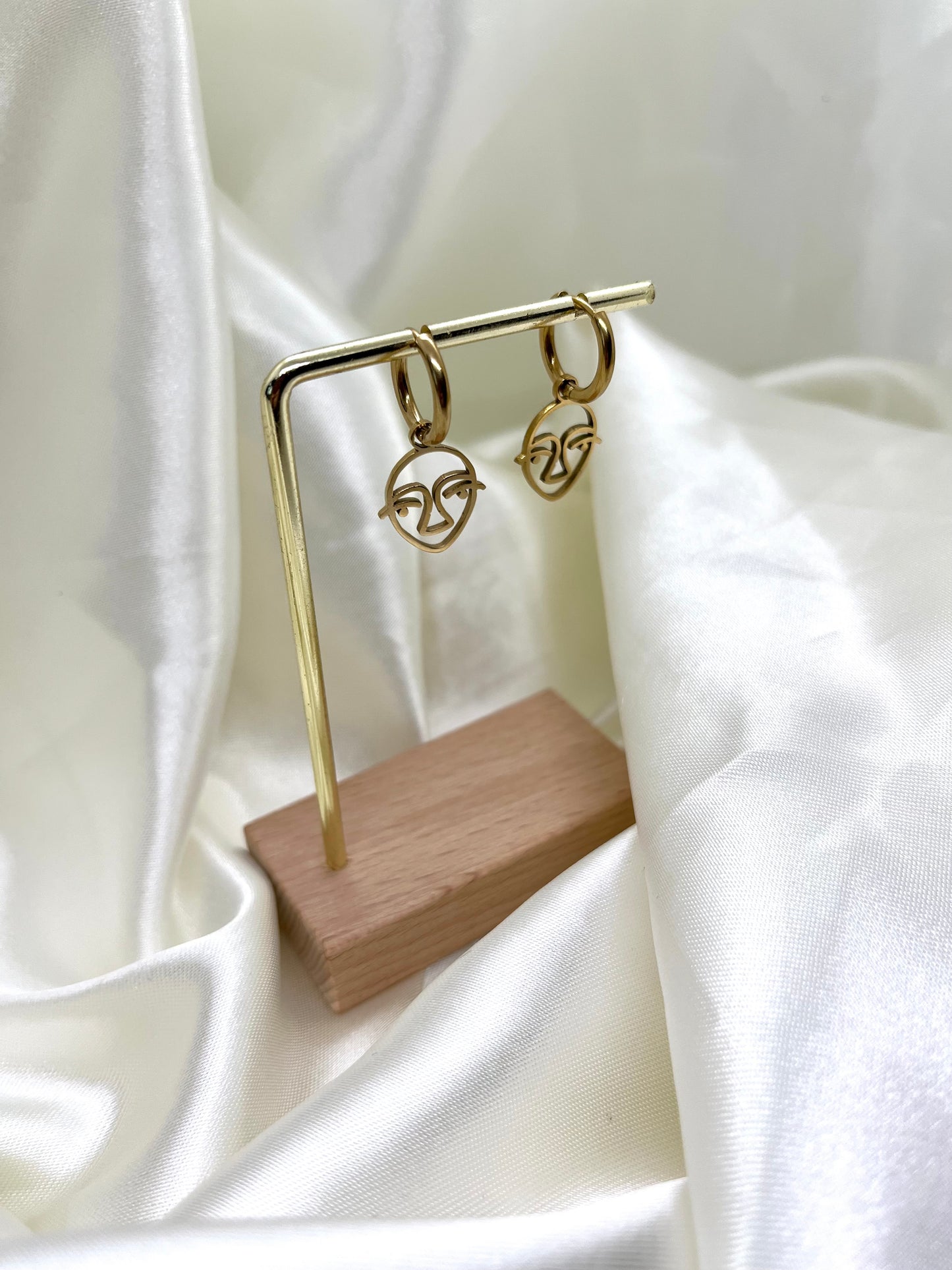 Boucles d’oreilles doré visage
