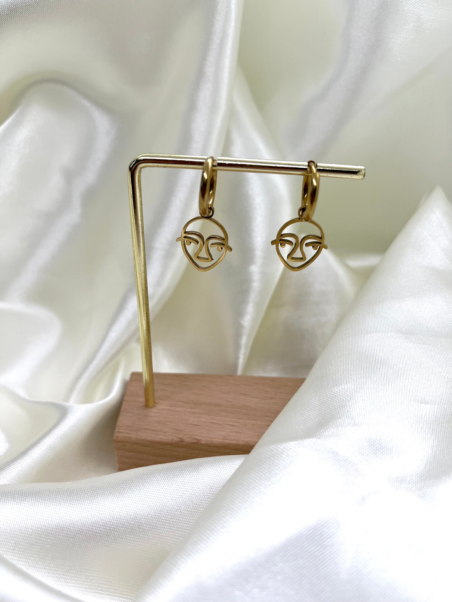Boucles d’oreilles doré visage