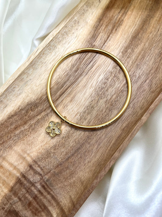 Bracelet jonc doré et fleur