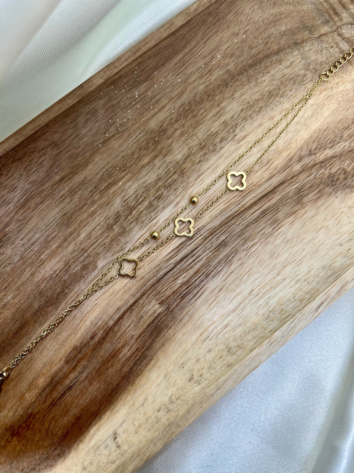 Bracelet double chaîne doré trèfles