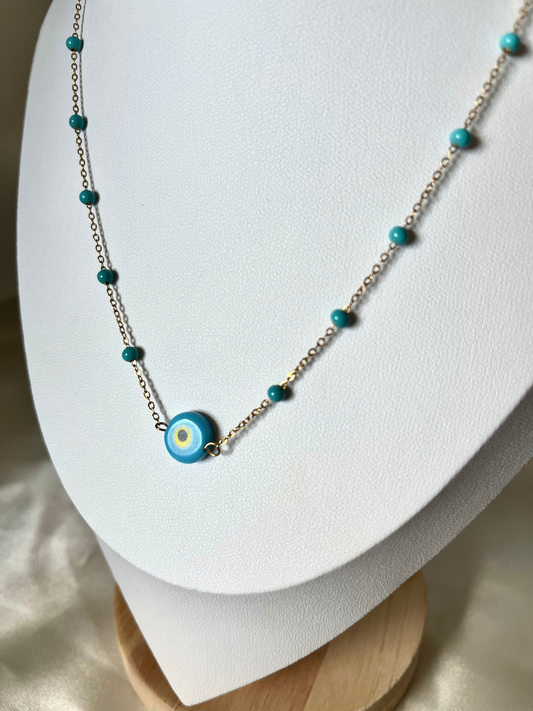 Collier doré et perles bleu Eros